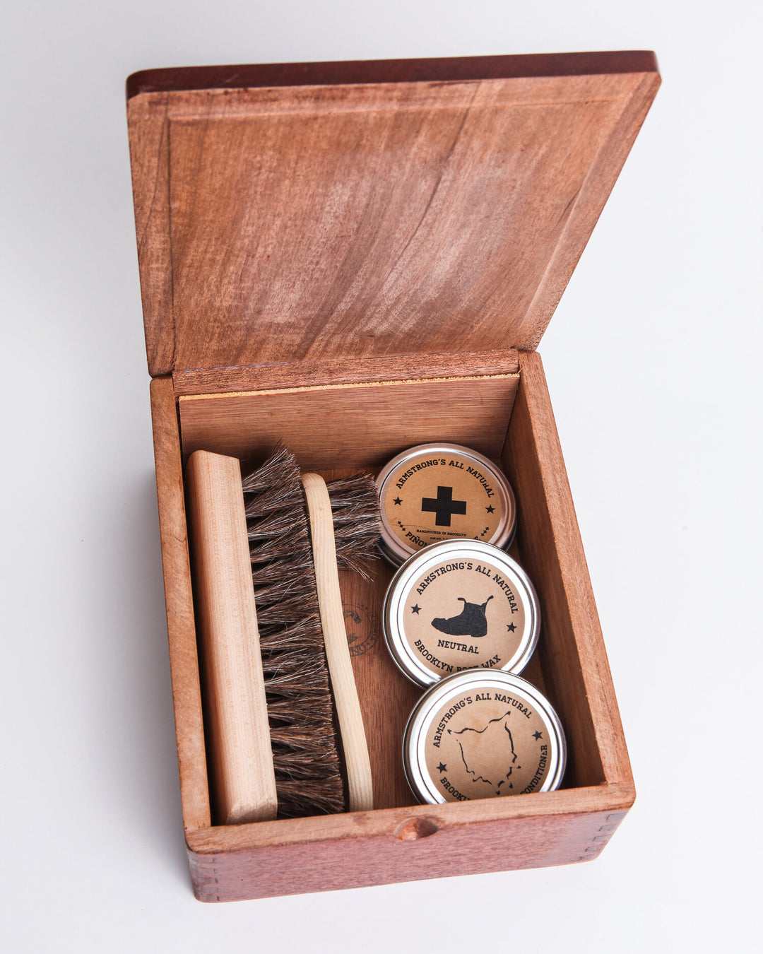 Cigar Box Shoe Shine Kit with brushes and wax for shoe care.