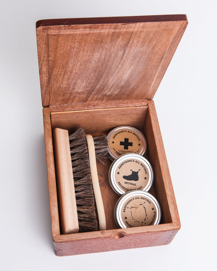 Cigar Box Shoe Shine Kit with brushes and wax for shoe care.