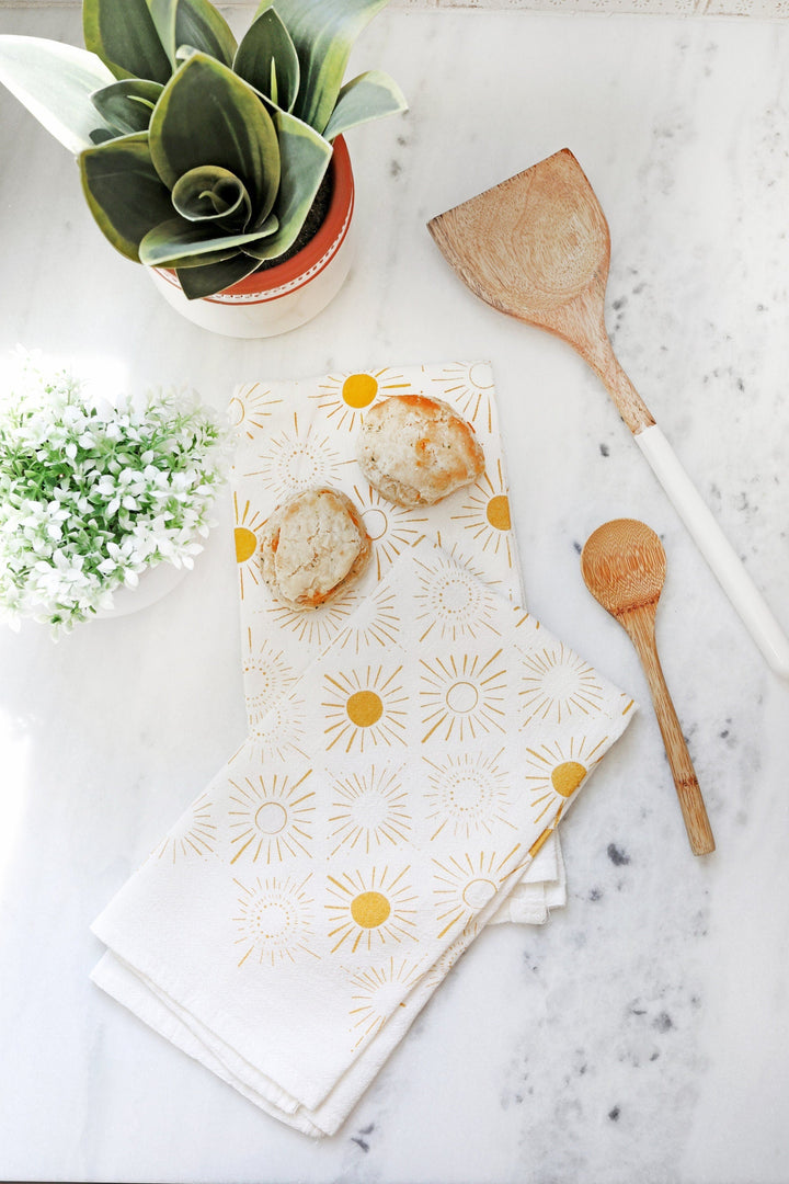 Cotton Sundance tea towel with an artistic watercolor design.