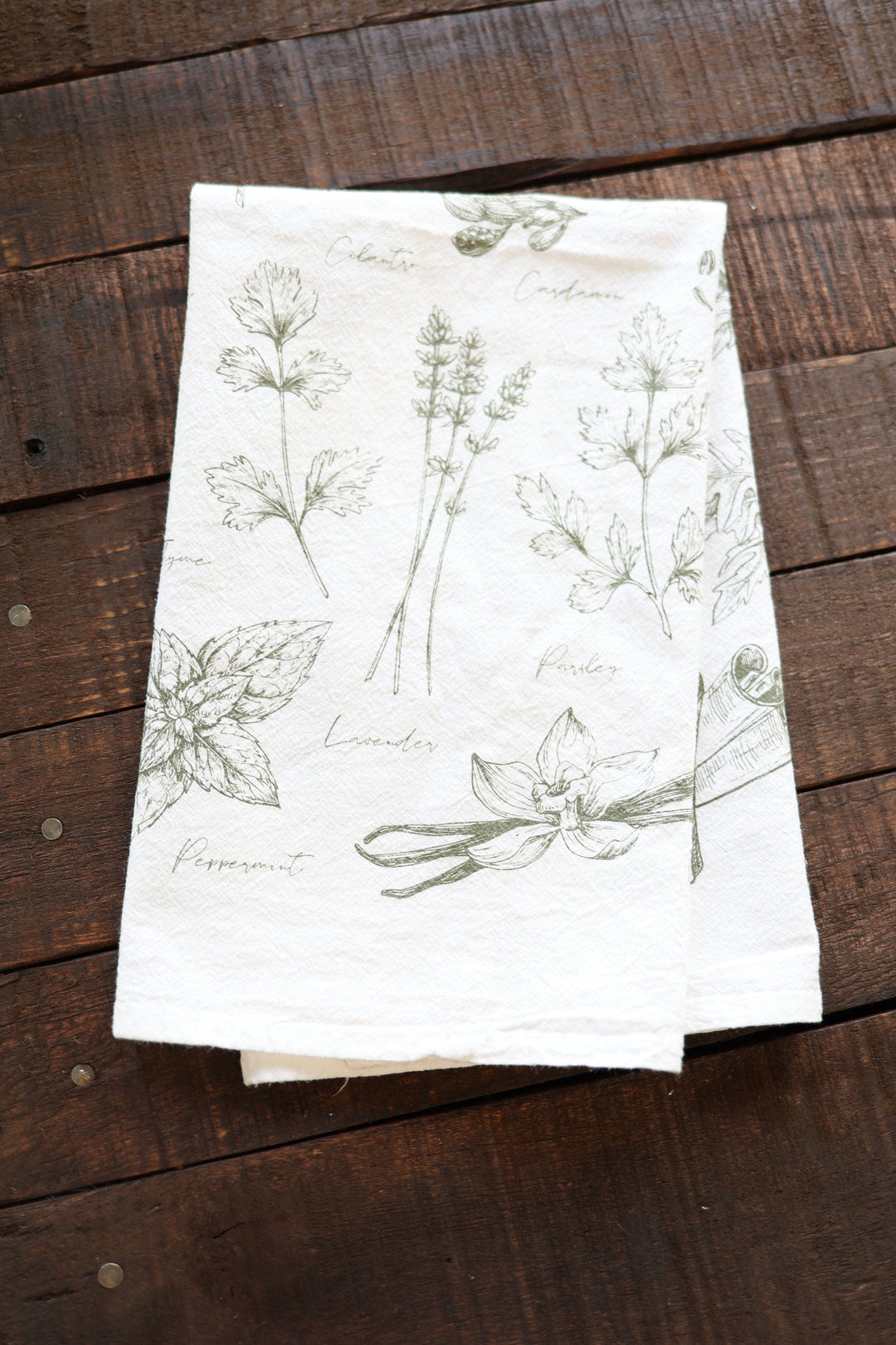 Cotton tea towel with a watercolor botanical herb print.