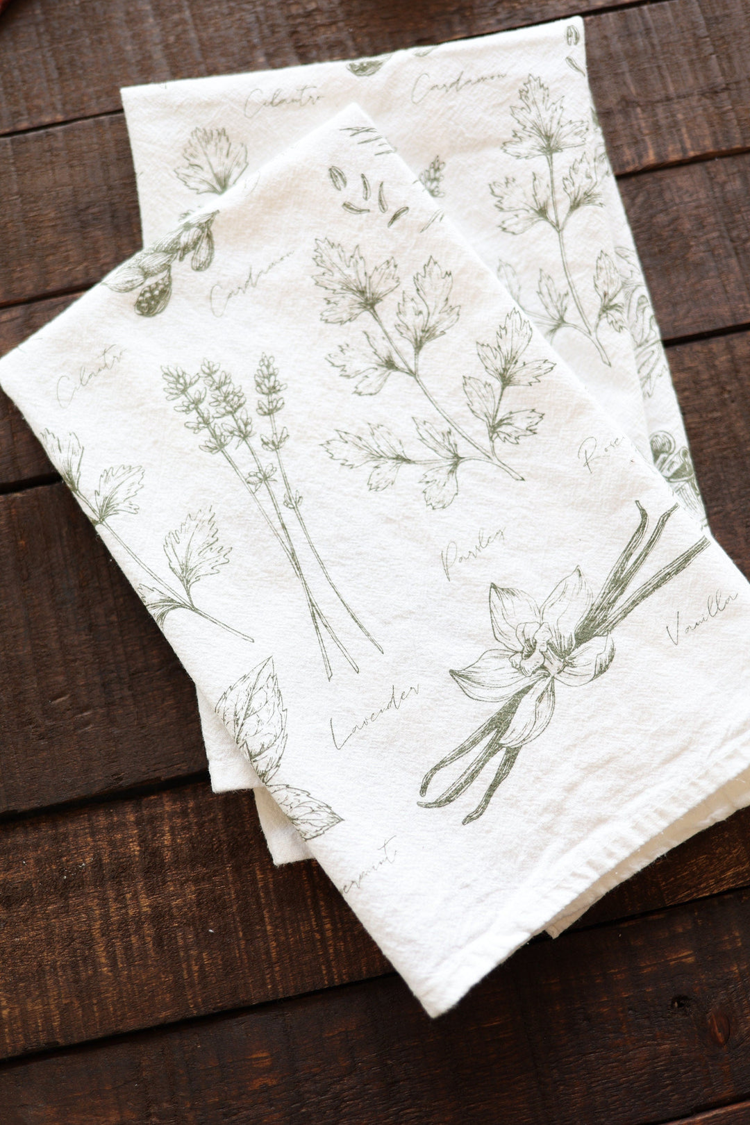 Kitchen herbs tea towel with a watercolor herb design for the kitchen.