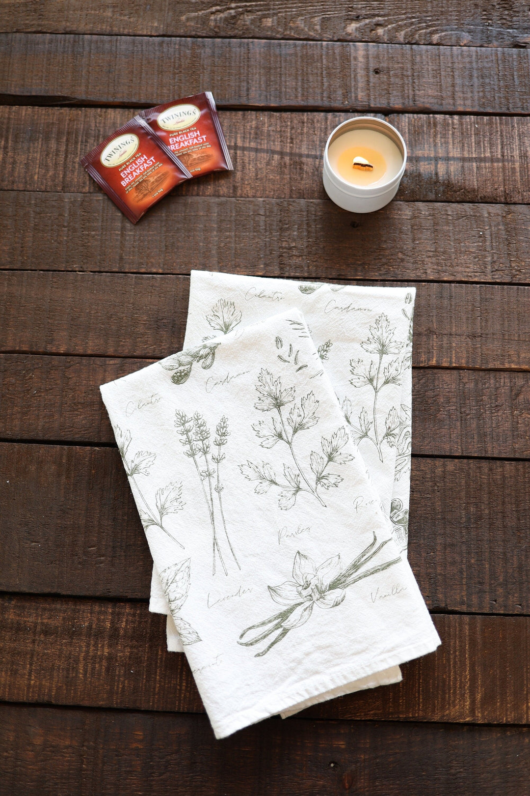 Kitchen herbs tea towel with watercolor herb illustrations on soft cotton.