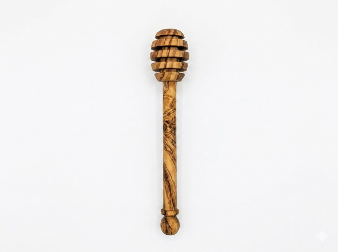 Olive wood honey spoon with a natural finish, designed for serving honey in Mediterranean style.