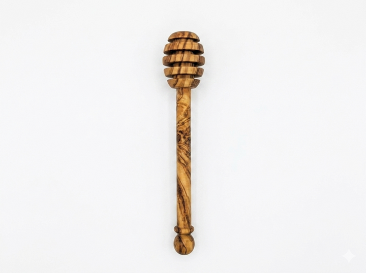 Olive wood honey spoon with a natural finish, designed for serving honey in Mediterranean style.
