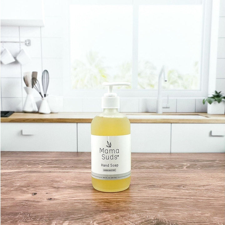 Olive oil and lemon hand soap with a pump dispenser, in a clear bottle.