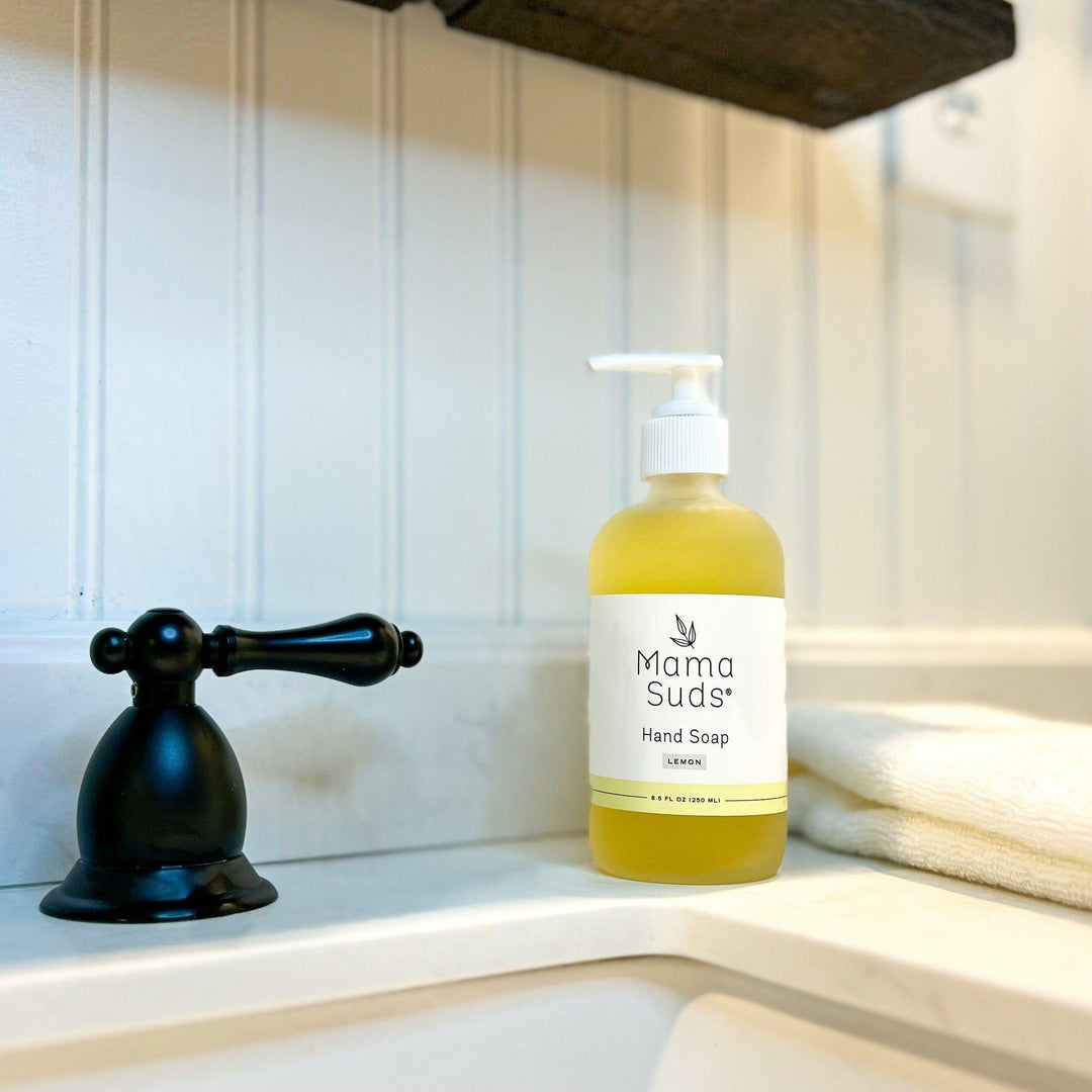 Olive oil and lemon hand soap in a clear pump bottle with a lemon-slice label.
