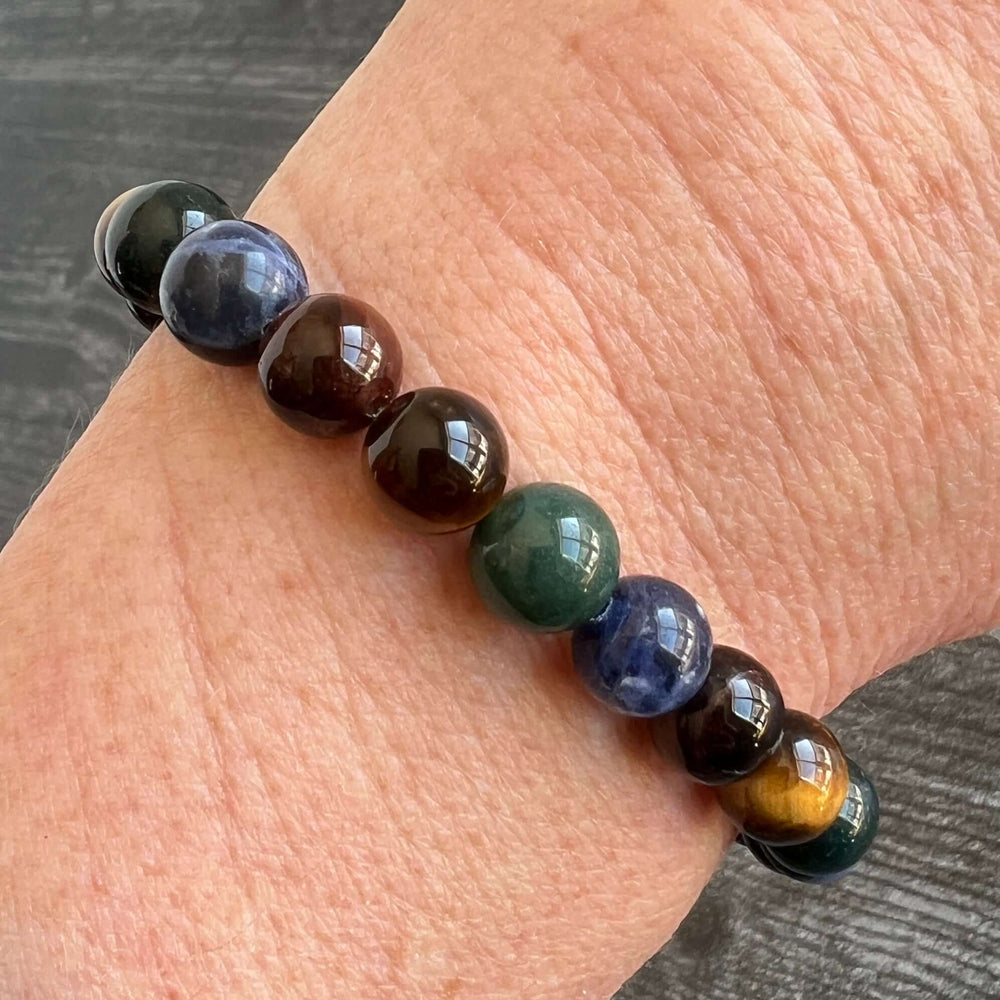Deep Woods bracelet with tiger eye and gemstone beads, polished stone detail.