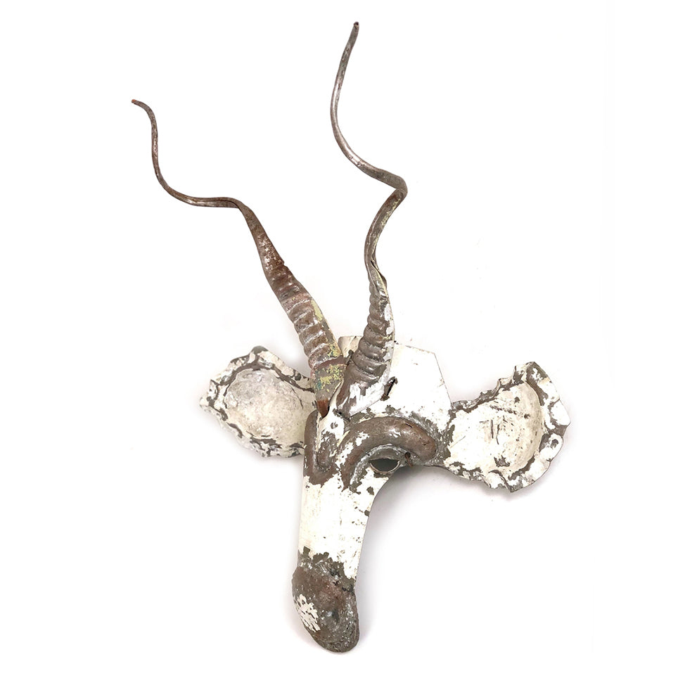Kudu antelope wall mask in recycled car tin, a sculptural African decor piece.