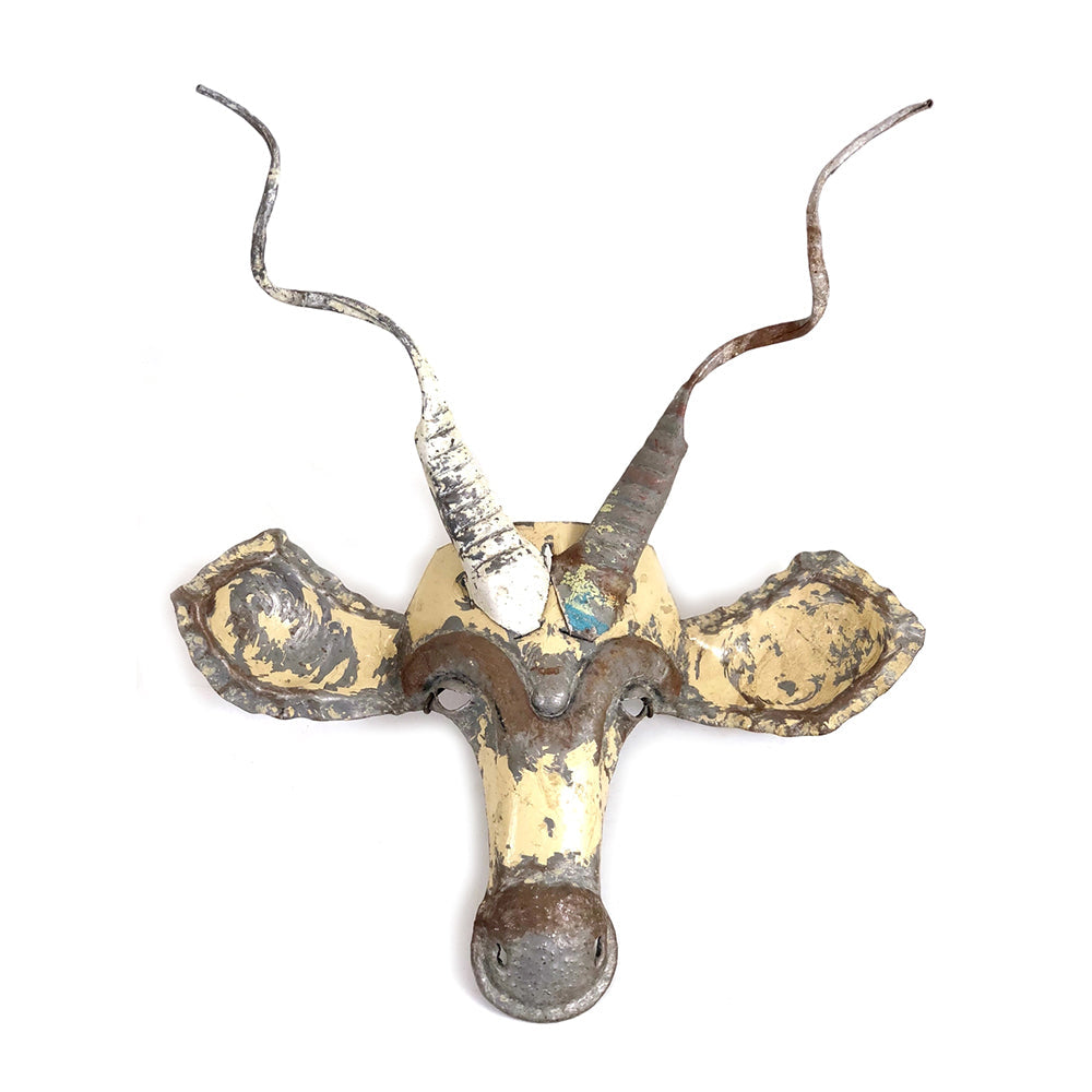 Detail of the recycled-metal kudu mask showing hand-cut metalwork.