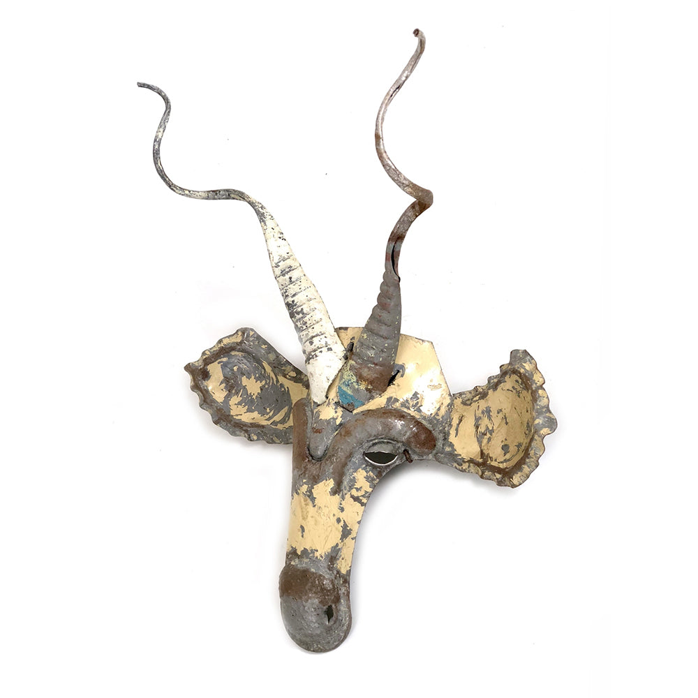 Kudu antelope mask with a bold cut-out metal design for the wall.