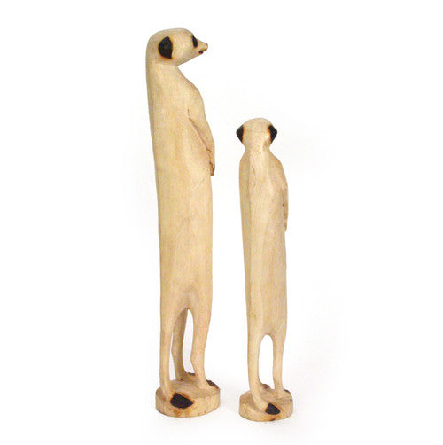Carved wooden meerkat sculpture with fine detail and natural grain.