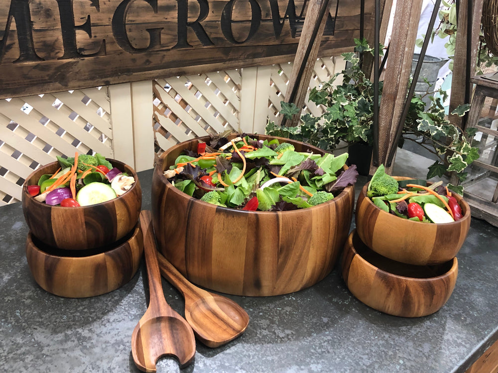 Dragor seven-piece acacia wood salad set with large and individual bowls.