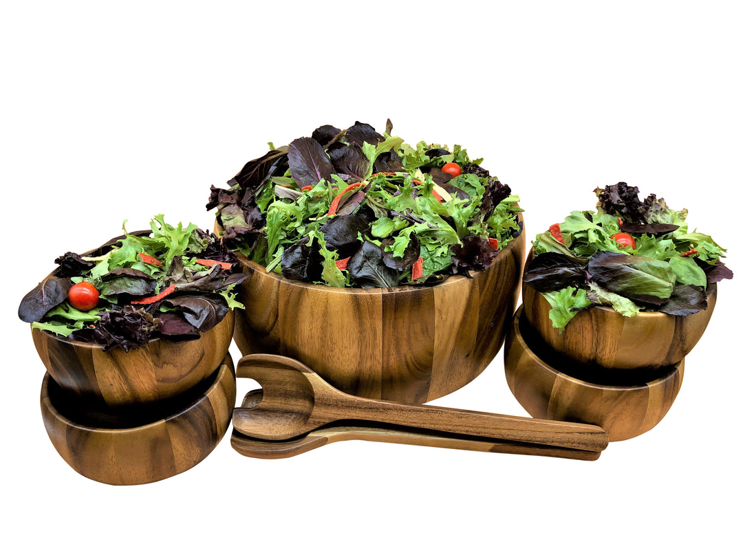 Dragor seven-piece acacia wood bowl set with smooth, rounded bowls.