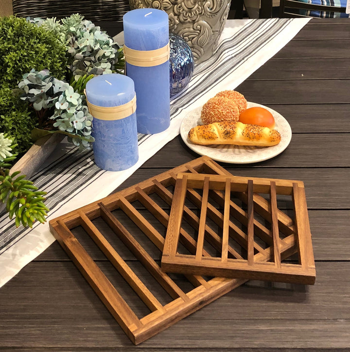 Acacia wood trivets that shield tables and counters from hot cookware.