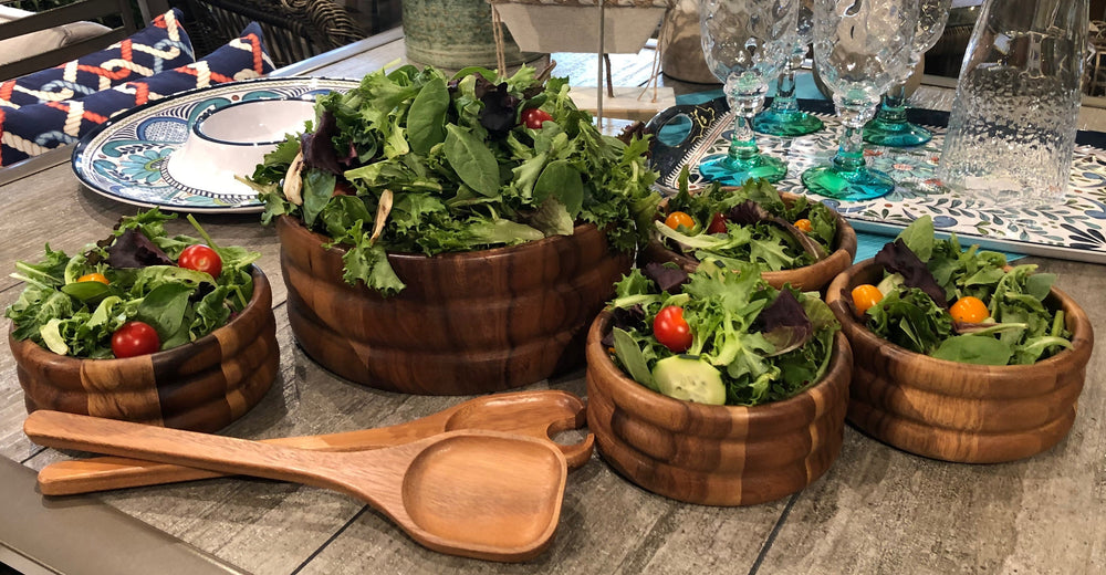 Skagen seven-piece acacia wood salad set with smooth, rounded bowls.