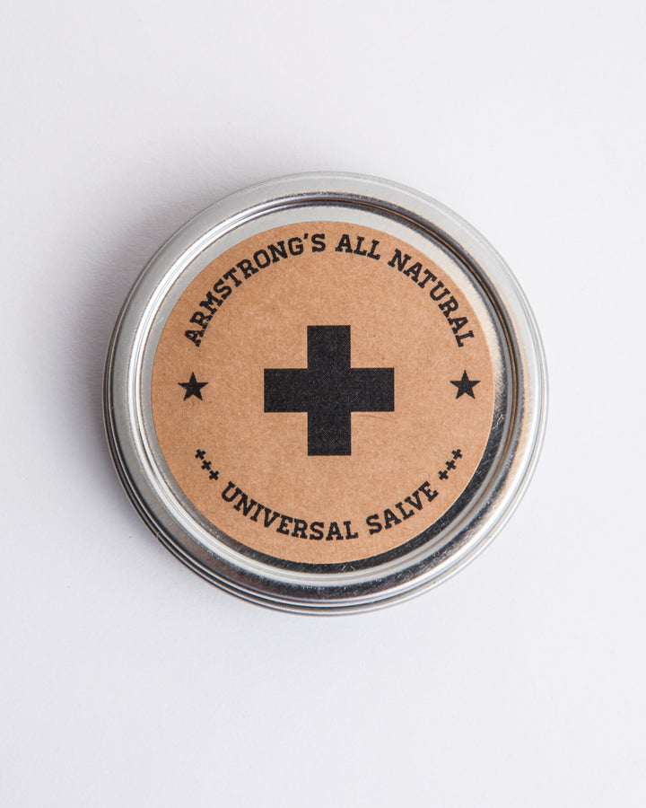 Universal Salve, a multi-purpose natural balm in a tin with a smooth, creamy texture.