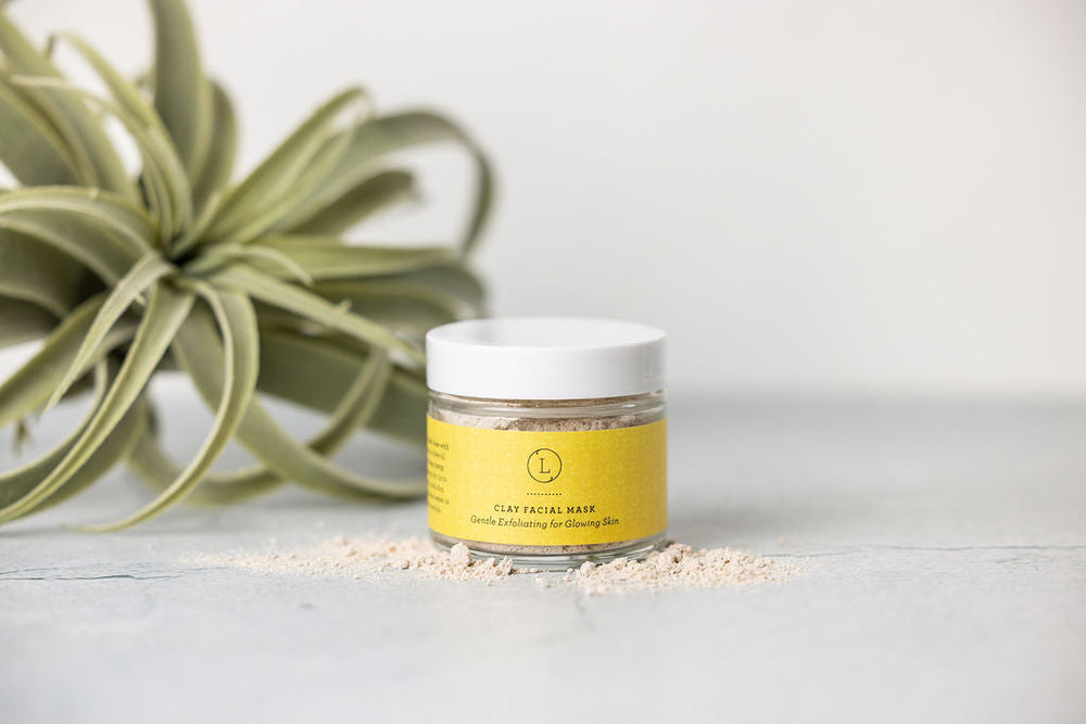 Grapefruit and shea butter body care set with a body cream and grapefruit body scrub.