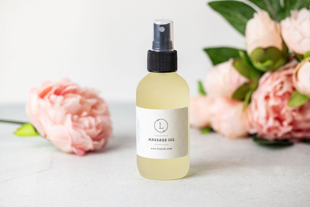 Eucalyptus massage oil in a glass bottle with eucalyptus leaves.