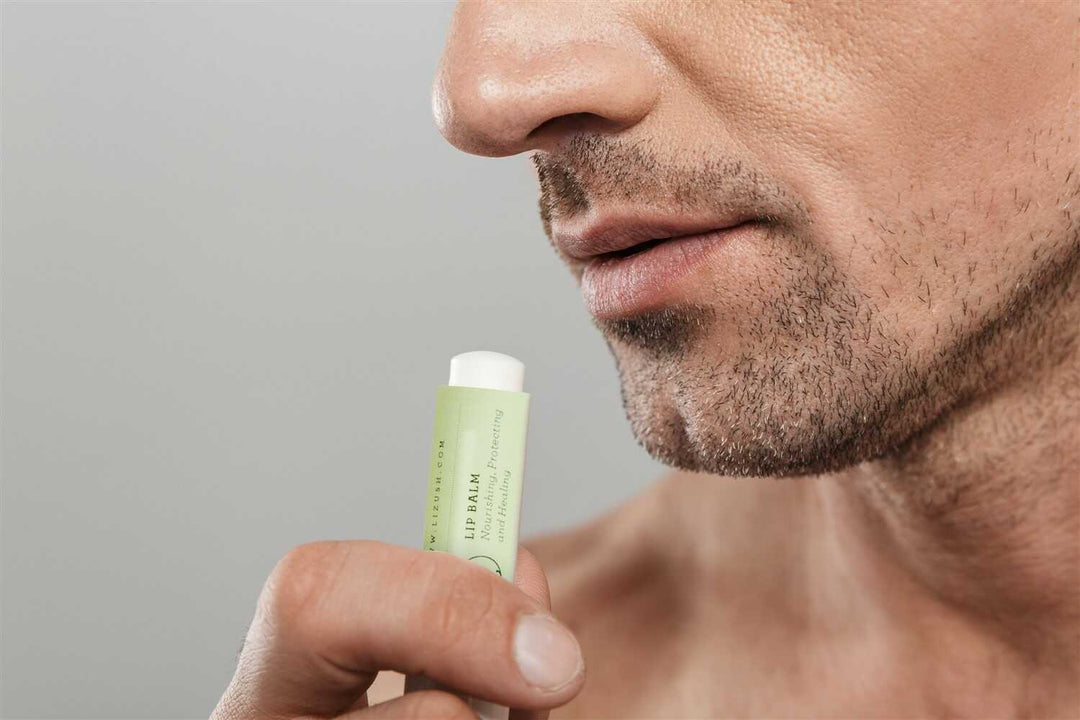 Unscented natural lip balms held in hand, showing simple packaging.