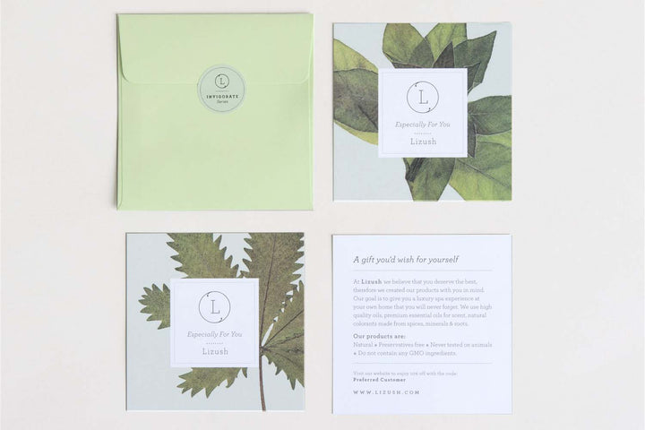 Eucalyptus massage oil surrounded by fresh eucalyptus leaves.