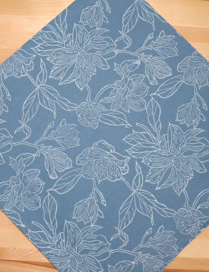 Magnolia cotton tea towel with a hand block printed floral design.