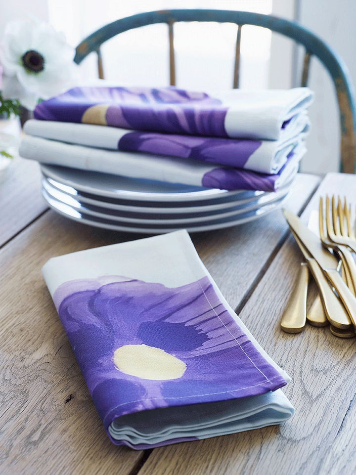 Purple poppies linen napkin set with a floral design on heavyweight fabric.