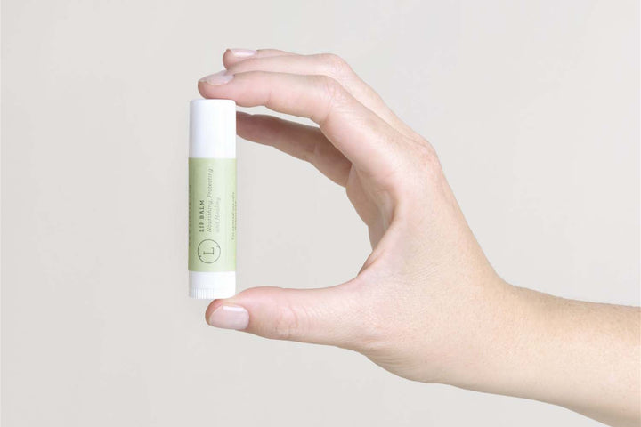 Handmade unscented natural lip balm set in eco-friendly packaging.