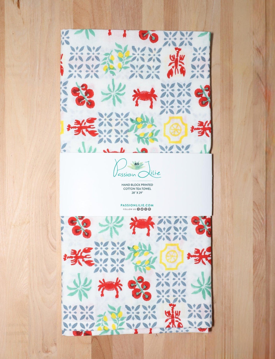 New Orleans Riviera cotton tea towel, hand block printed with crawfish, crabs, and citrus.