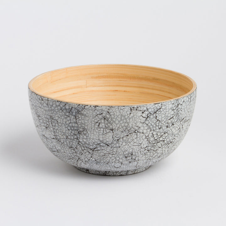 Large handcrafted bamboo salad bowl with a smooth natural finish and deep bowl.
