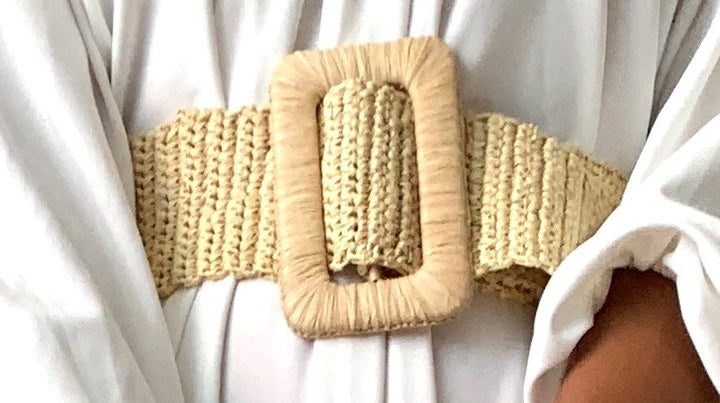 Brown woven straw belt, a natural accent for casual summer outfits.