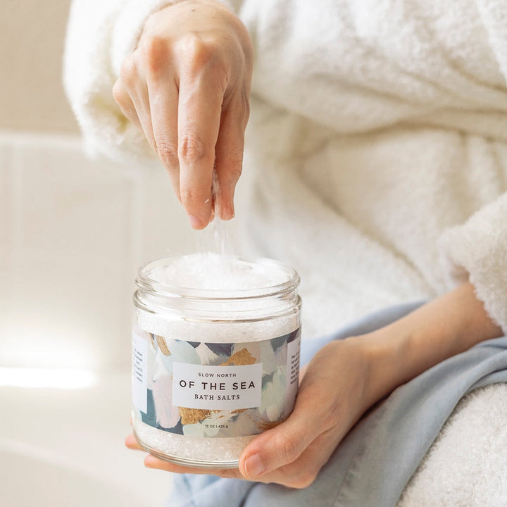 Of The Sea bath salts shown in elegant glass packaging.