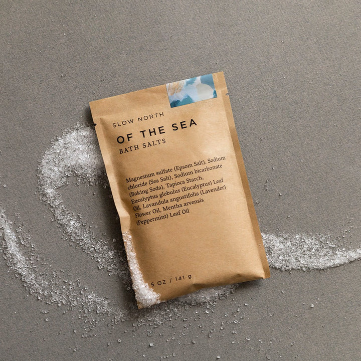 Kraft pouch of Of The Sea bath salts with eucalyptus and lavender essential oils visible through packaging.
