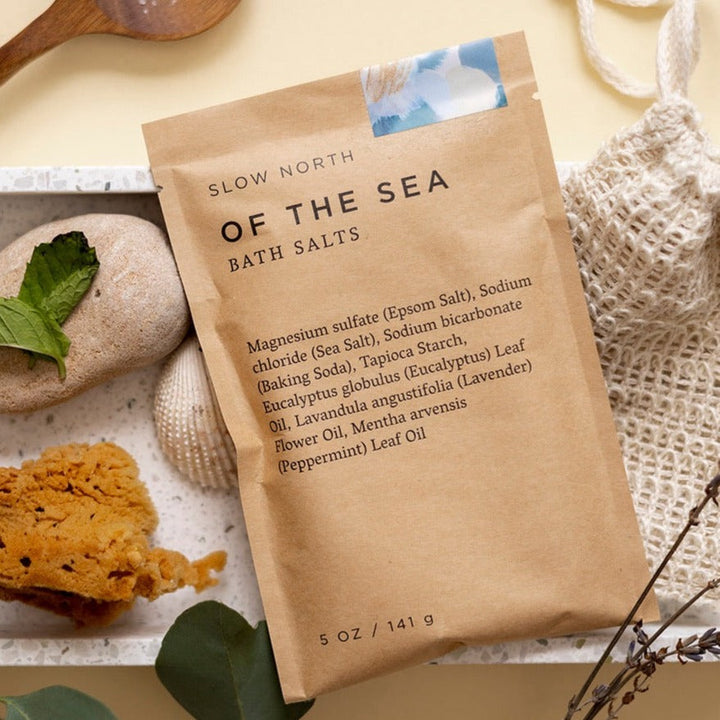 Bath salts in a pouch showing colorful herbal mixture and natural salt crystals.