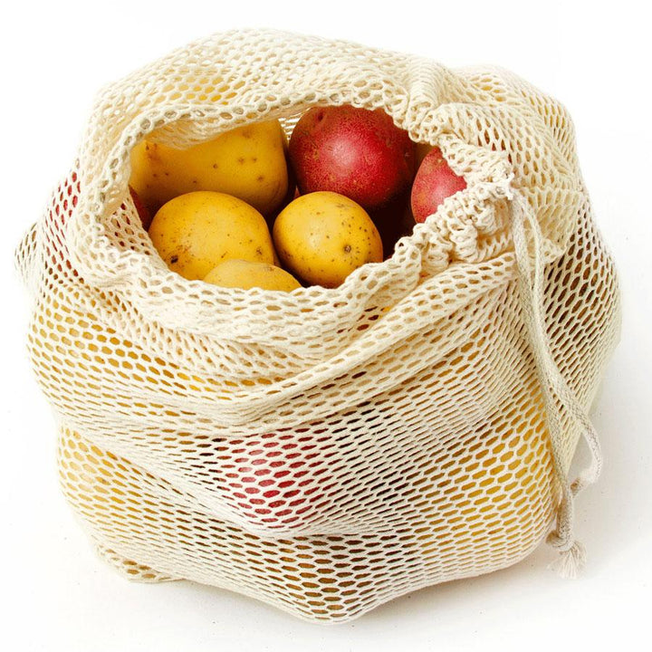 Set of two organic cotton mesh bags, breathable storage for produce and shopping.