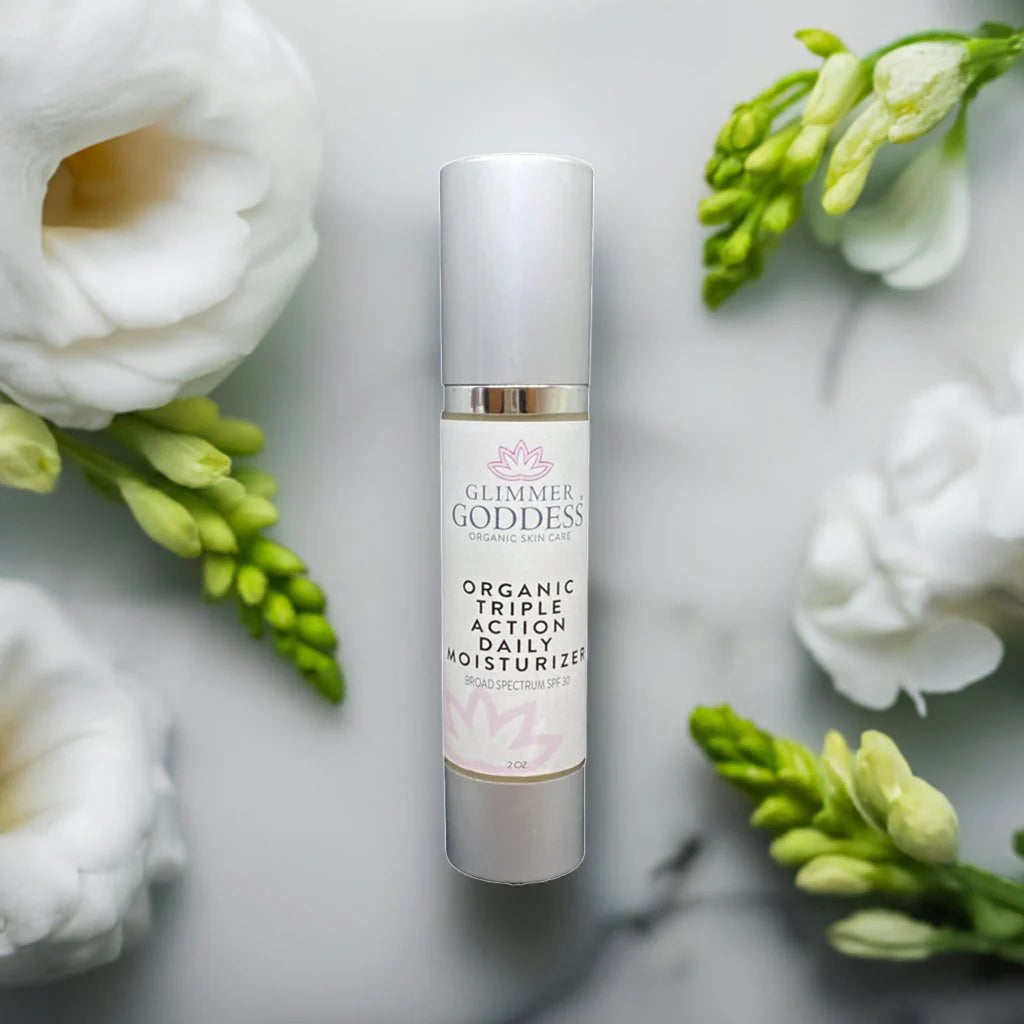 Organic daily face moisturizer with SPF 30, creamy texture.