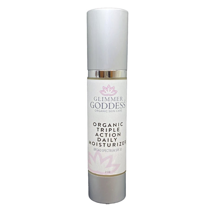 Organic Triple Action Daily Face Moisturizer with SPF 30 from DC-Glimmer Goddess®, showing the cream in a white jar with a green lid.