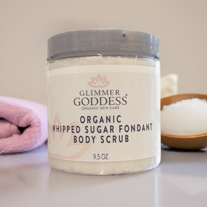 Organic whipped sugar body scrub with a creamy, exfoliating texture.