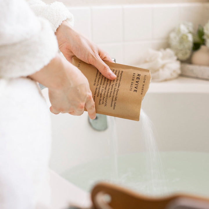 Bath salts pouch with herbaceous essential oil blend and natural packaging.