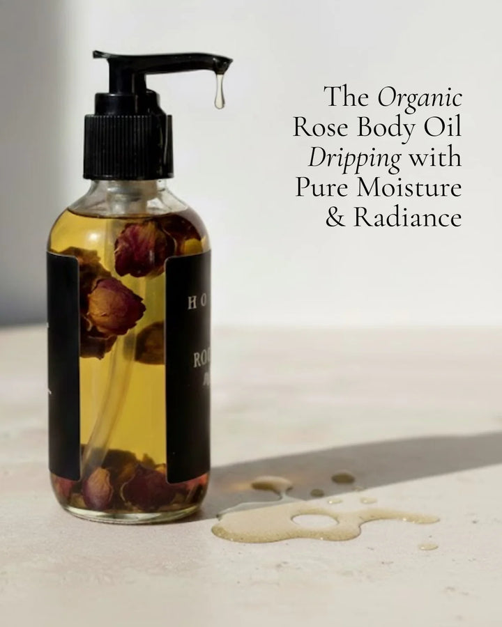 Organic rose body oil in a clear glass bottle with a dropper.