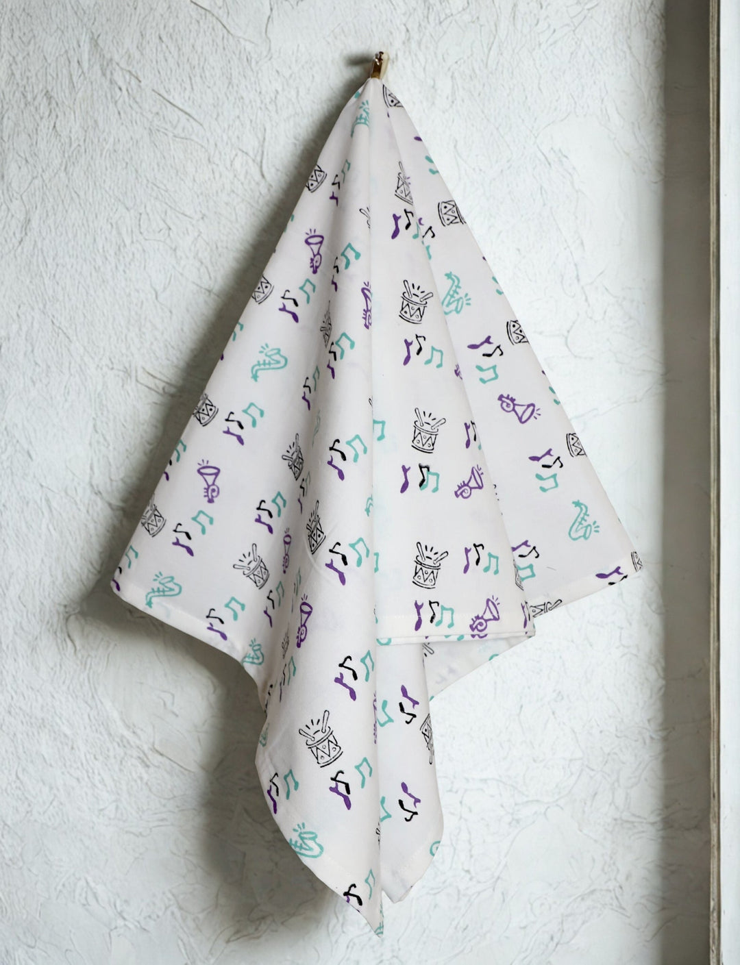 Second Line cotton tea towel with a hand block printed design.