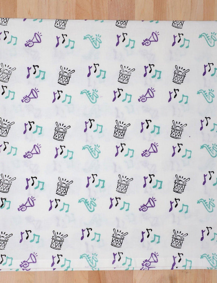 Second Line cotton tea towel with a hand block printed music design.