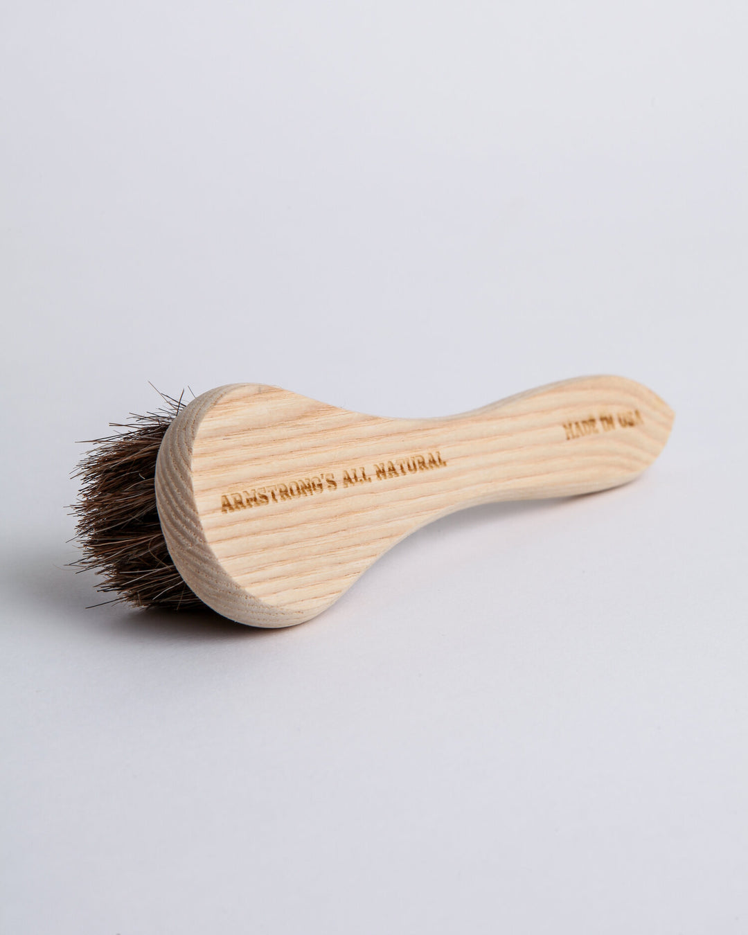 Natural horsehair dauber with a wood handle, showing the soft bristles and polished wooden grip.