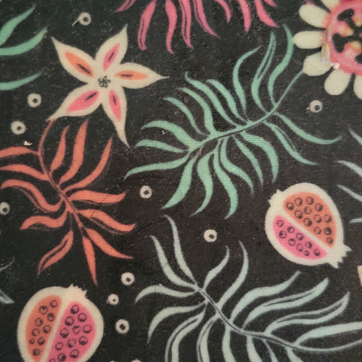 Reusable organic beeswax food wraps in various sizes with colorful patterns.