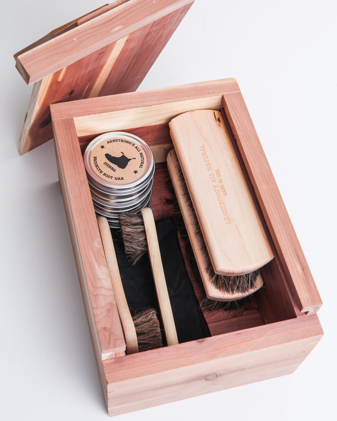 Shoe Shine Box kit with brushes and wax for shoe care and shine.