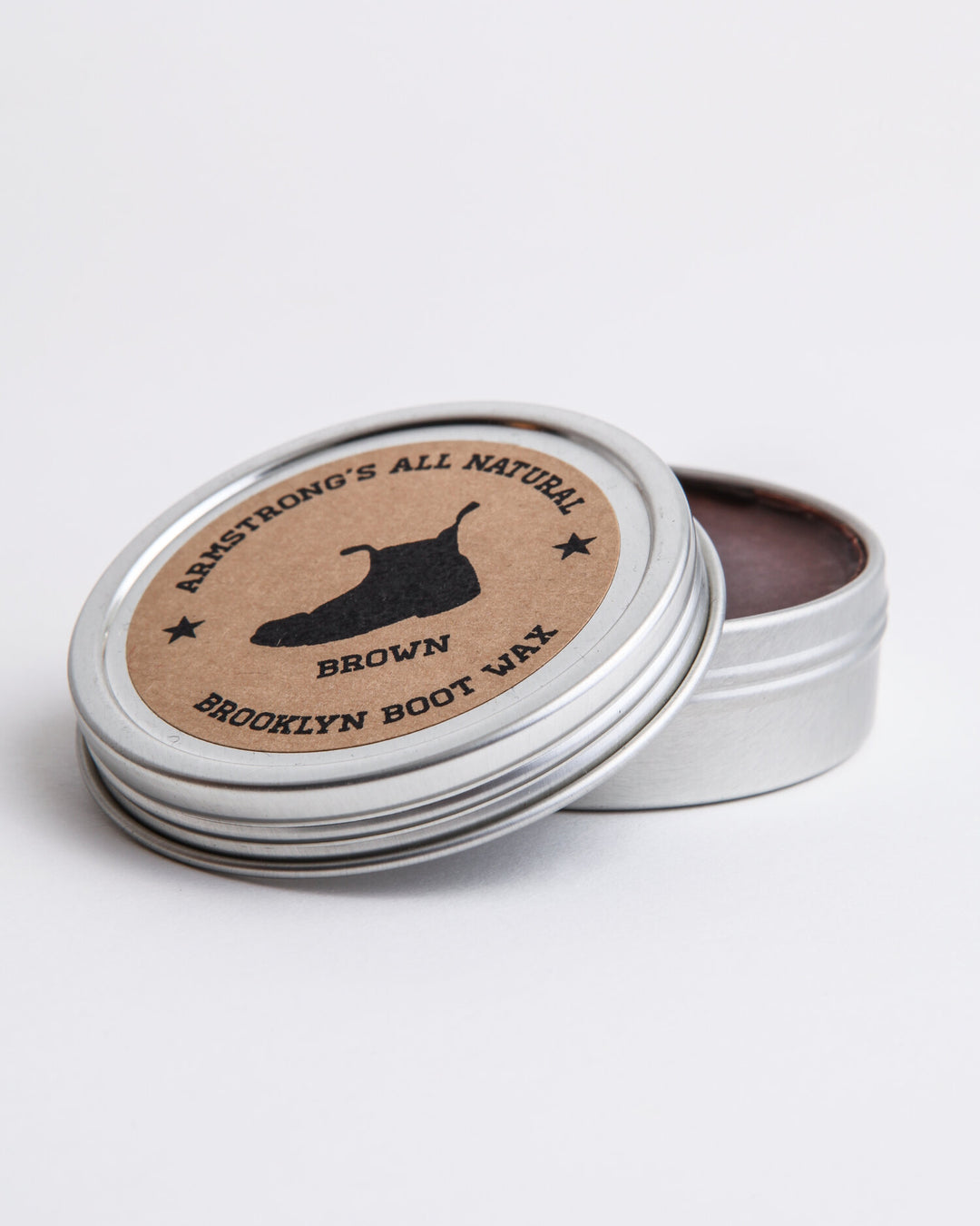Brooklyn Boot Wax in pigmented black, showing the tin and wax texture.