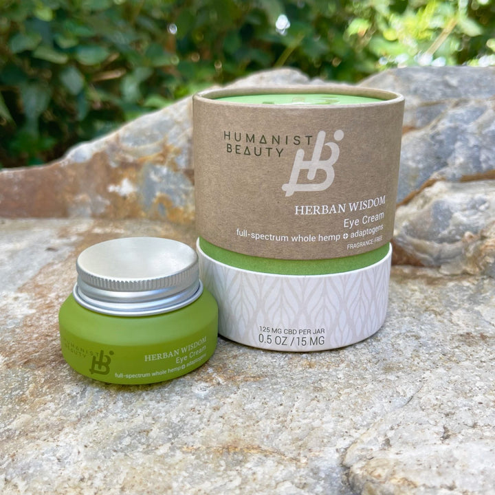 Herban Wisdom eye cream jar with a creamy texture for the eye area.