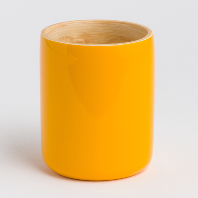 Ly bamboo mug with a smooth bamboo surface and handle, for hot drinks.