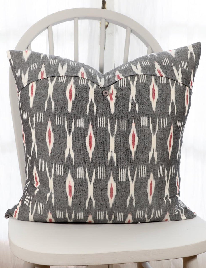 Grey and red XO ikat cotton throw pillow cover, close-up of the pattern.