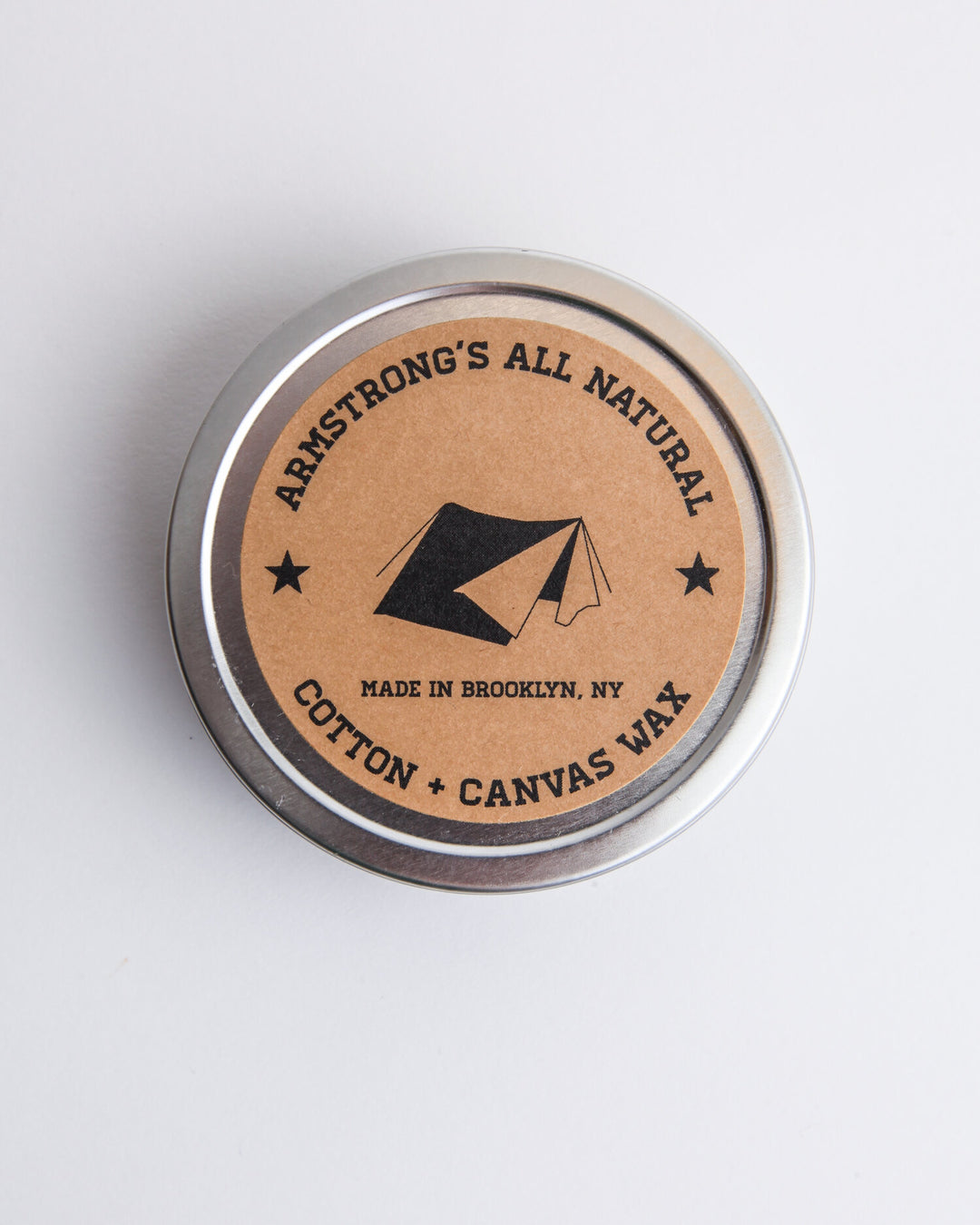 Cotton canvas wax for natural waterproofing, shown applied to fabric for protection.